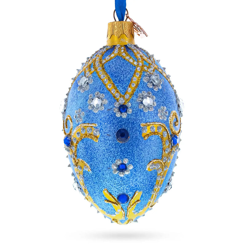 Jewels and Golden Scrolls On Glitter Blue Glass Egg Ornament