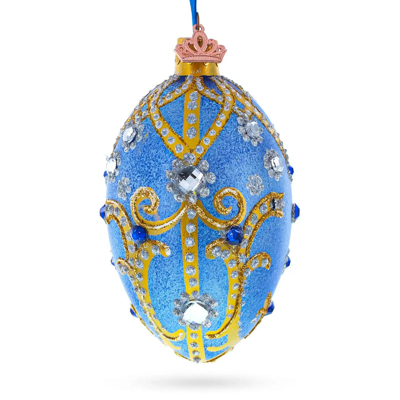 Jewels and Golden Scrolls On Glitter Blue Glass Egg Ornament